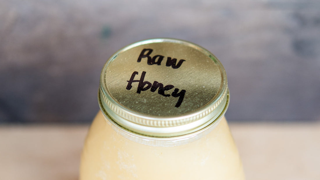 A jar of naturally crystallised raw honey